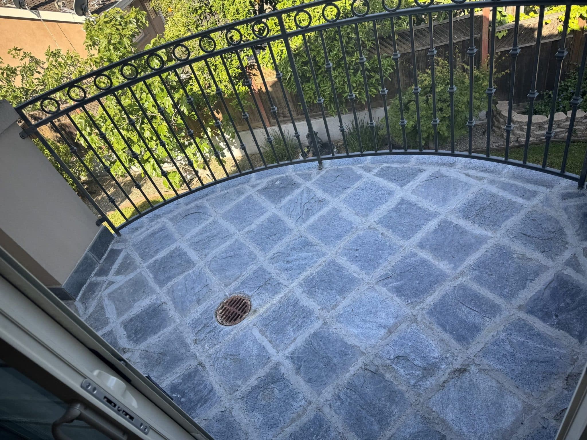 Balcony with iron railing prepared for a waterproofing membrane on a Quartz project (location not identified)